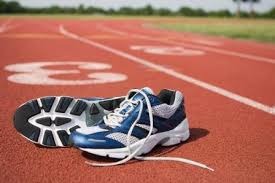 image of a pair of running shoes on a track